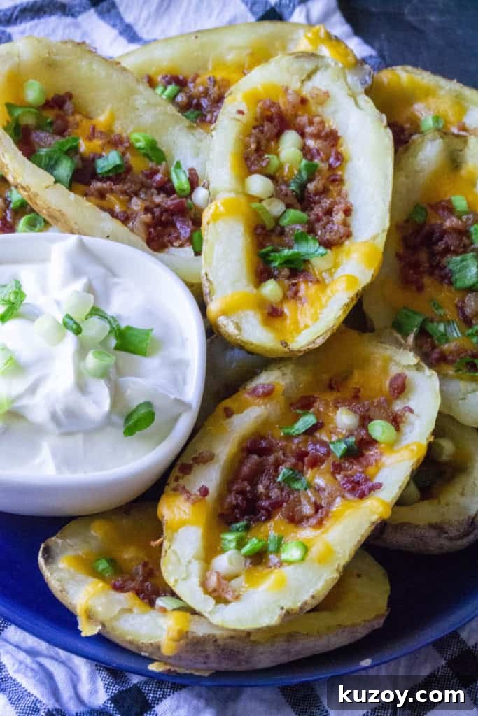 Crispy Stuffed Potato Skins with Cheesy Bacon Filling 10 plate of crispy potato skins