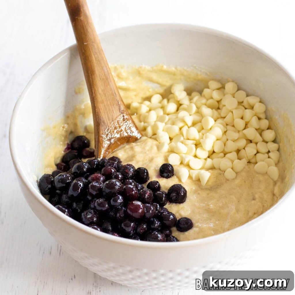 blueberries and white chips added to bowl
