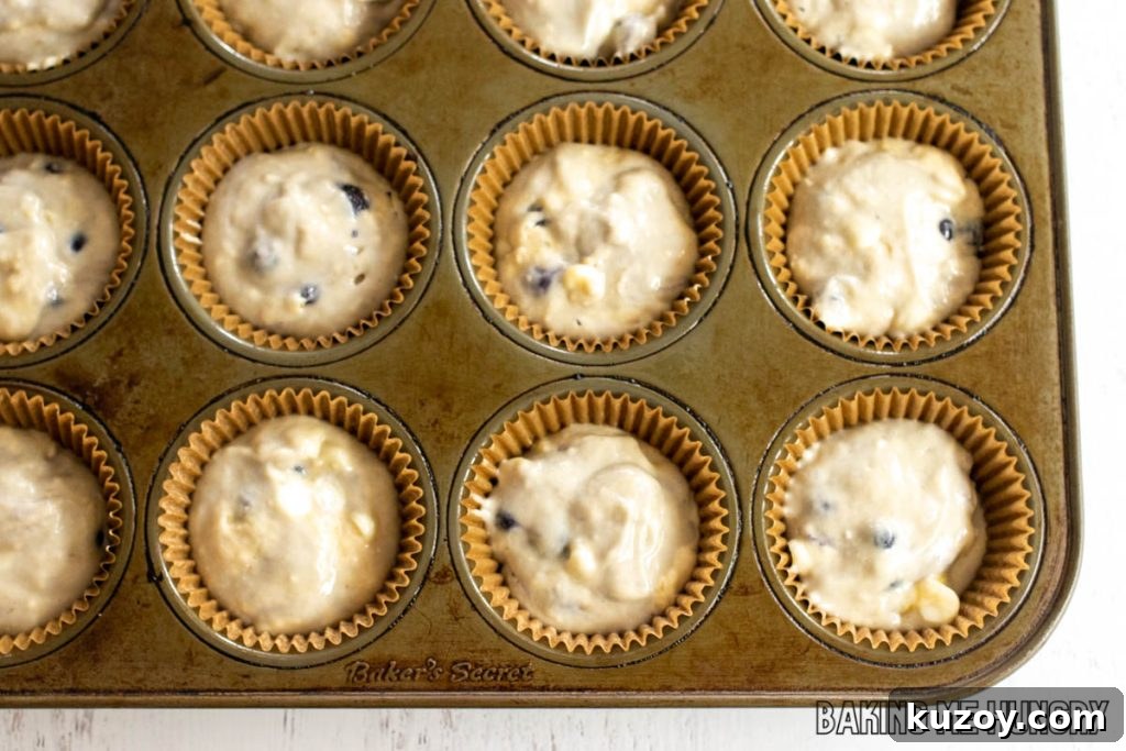 batter in paper liners in cupcake tin