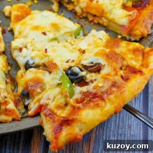 Weight Watchers Pizza Recipe with 2-Ingredient Dough 12 slice of weight watchers pizza being lifted off a pizza pan