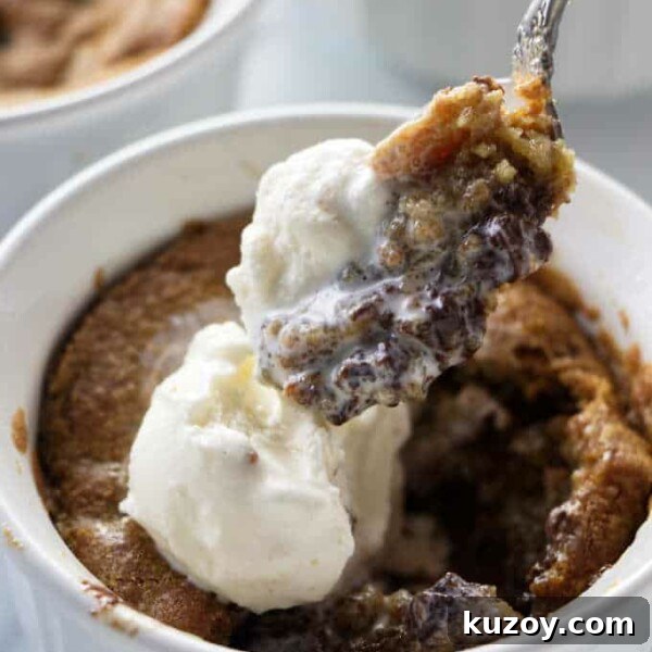 Air Fryer Chocolate Lava Mug Cake Recipe 16 A spoon scooping into a deep dish cookie bowl.