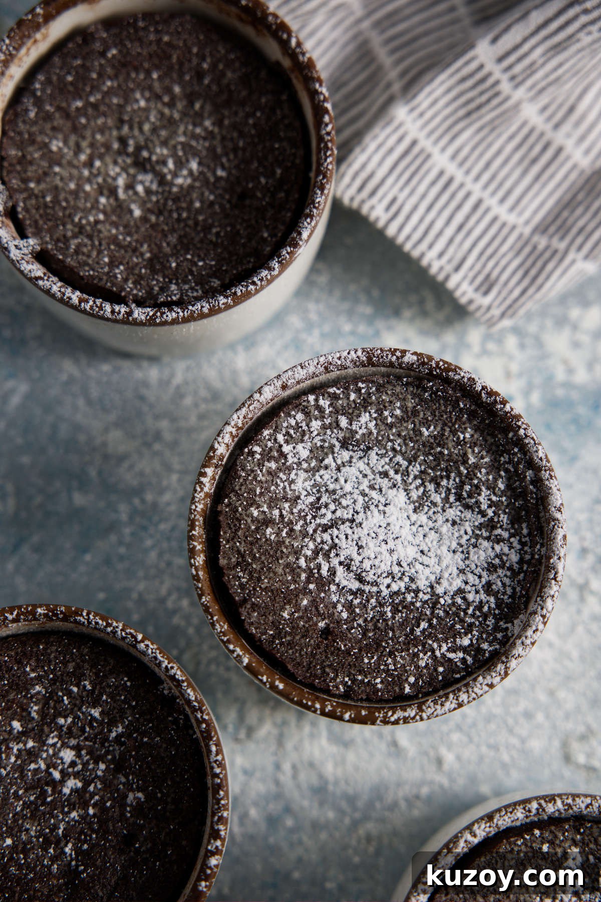 Air Fryer Chocolate Lava Mug Cake Recipe 23 Air fryer mug cakes dusted with powdered sugar.