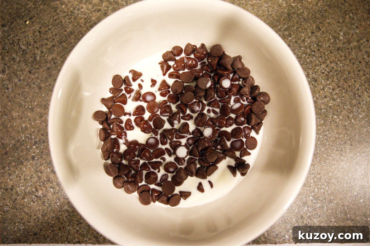 Air Fryer Chocolate Lava Mug Cake Recipe 6 Chocolate chips and cream in a bowl for ganache.