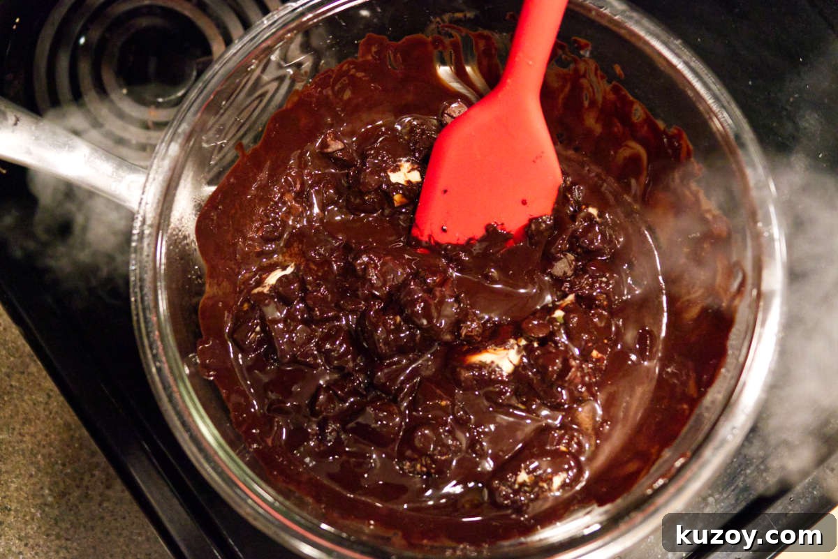 Air Fryer Chocolate Lava Mug Cake Recipe 7 Melting chocolate in a bowl using a double boiler.