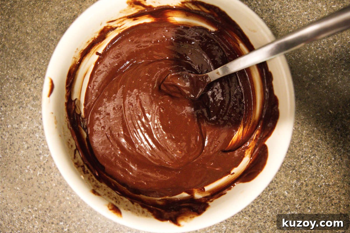 Air Fryer Chocolate Lava Mug Cake Recipe 8 Mixing together chocolate ganache for air fryer mug cake.