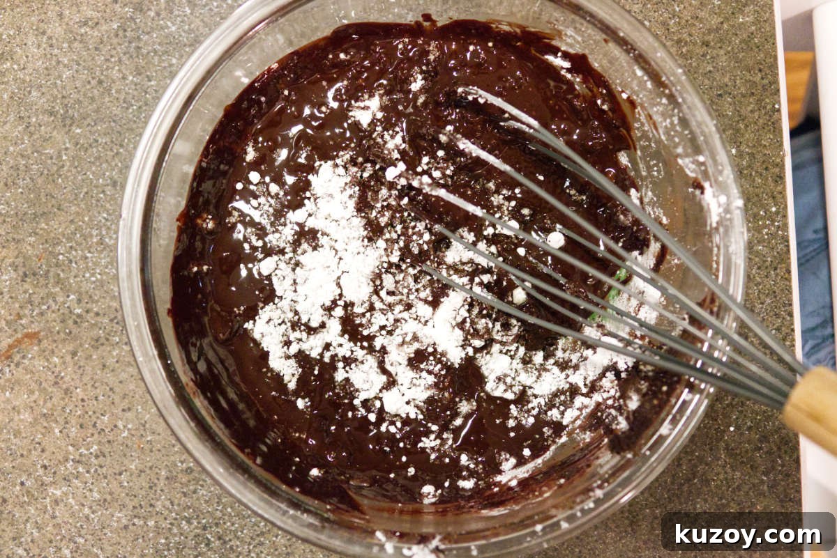Air Fryer Chocolate Lava Mug Cake Recipe 9 Mixing together ingredients for chocolate lava cake.