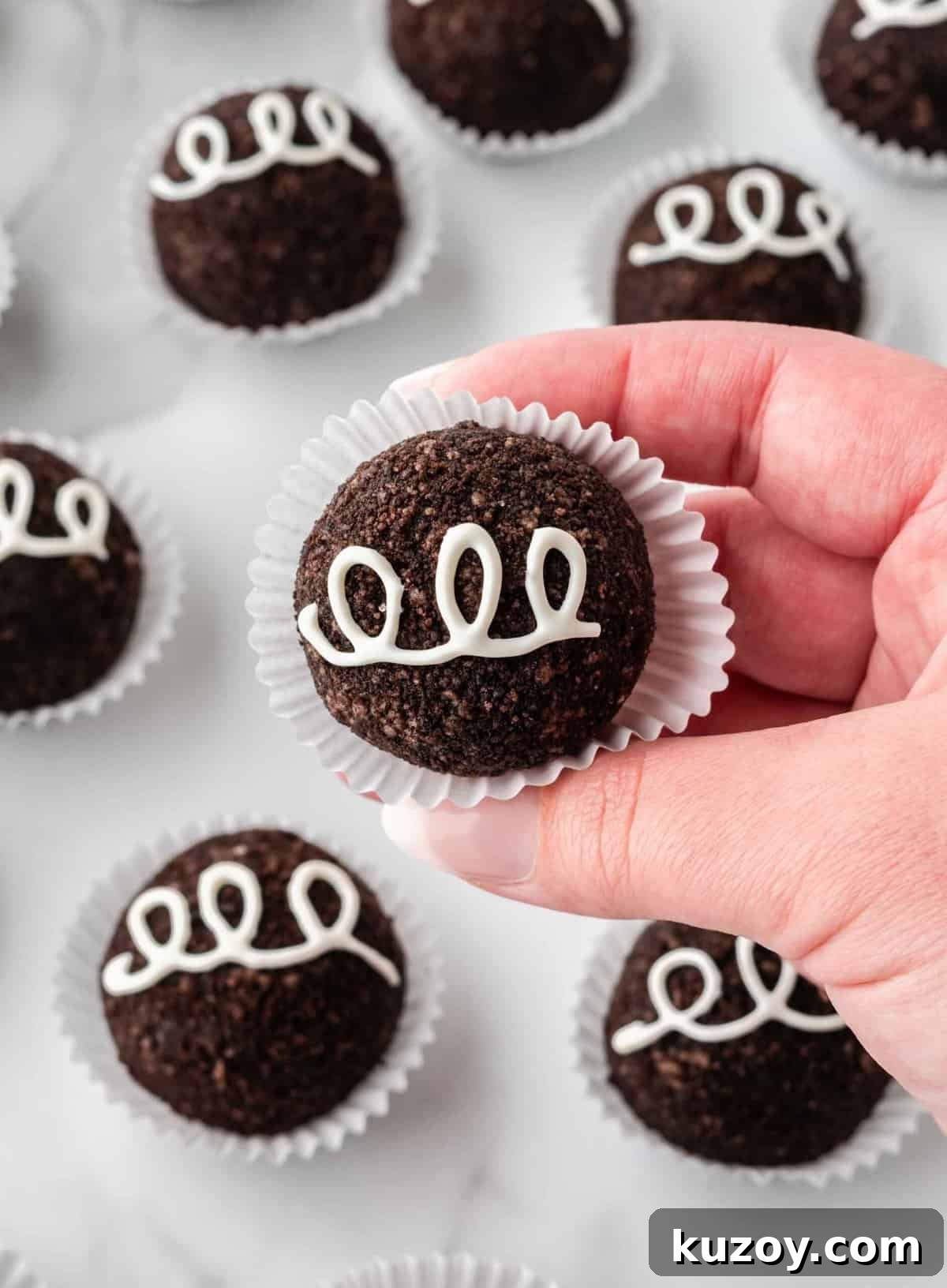 oreo balls without dipping in chocolate, decorated as little debbie cupcakes