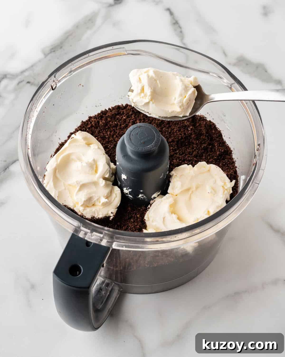 blended oreo crumbs with cream cheese in food processor