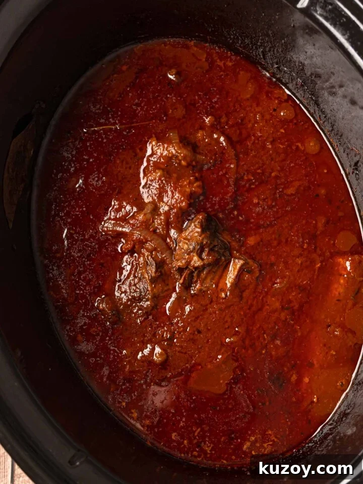 Italian pot roast cooked until tender in a slow cooker with thick tomato gravy.