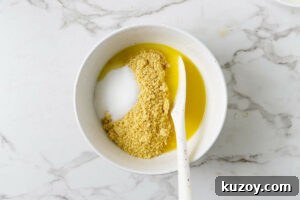 stirring butter and sugar into cookie crumbs.