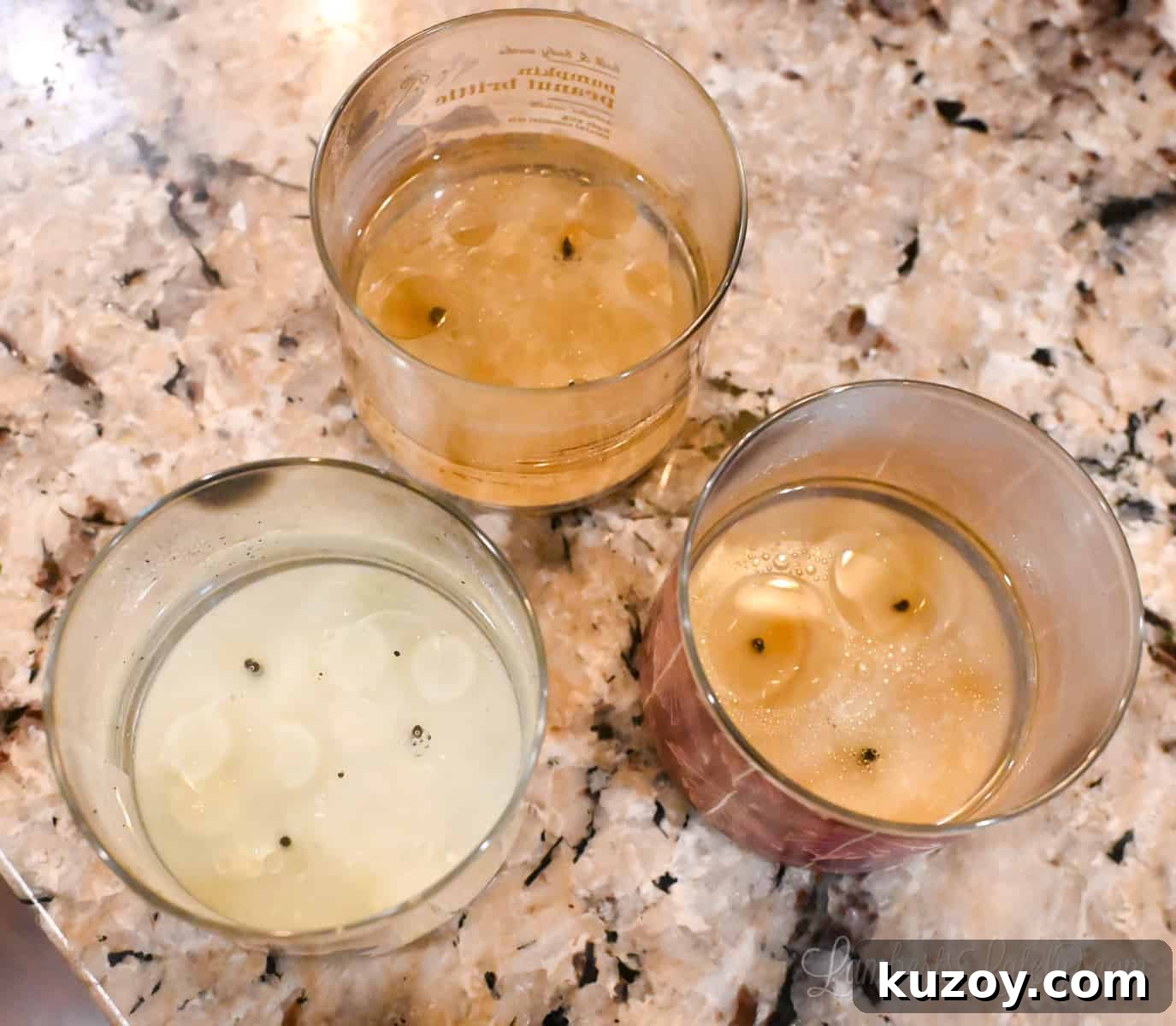 Remove Wax from Candle Jars: 3 Fast, Effective Methods 11 three candle jars with hot water in them.