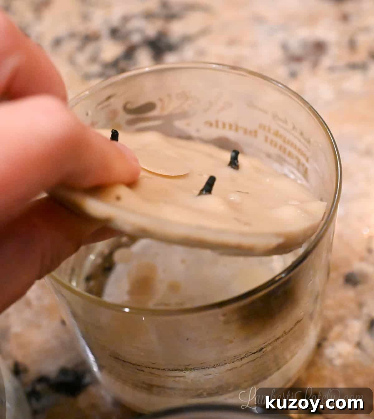 Remove Wax from Candle Jars: 3 Fast, Effective Methods 12 pulling dried wax out of a candle jar.
