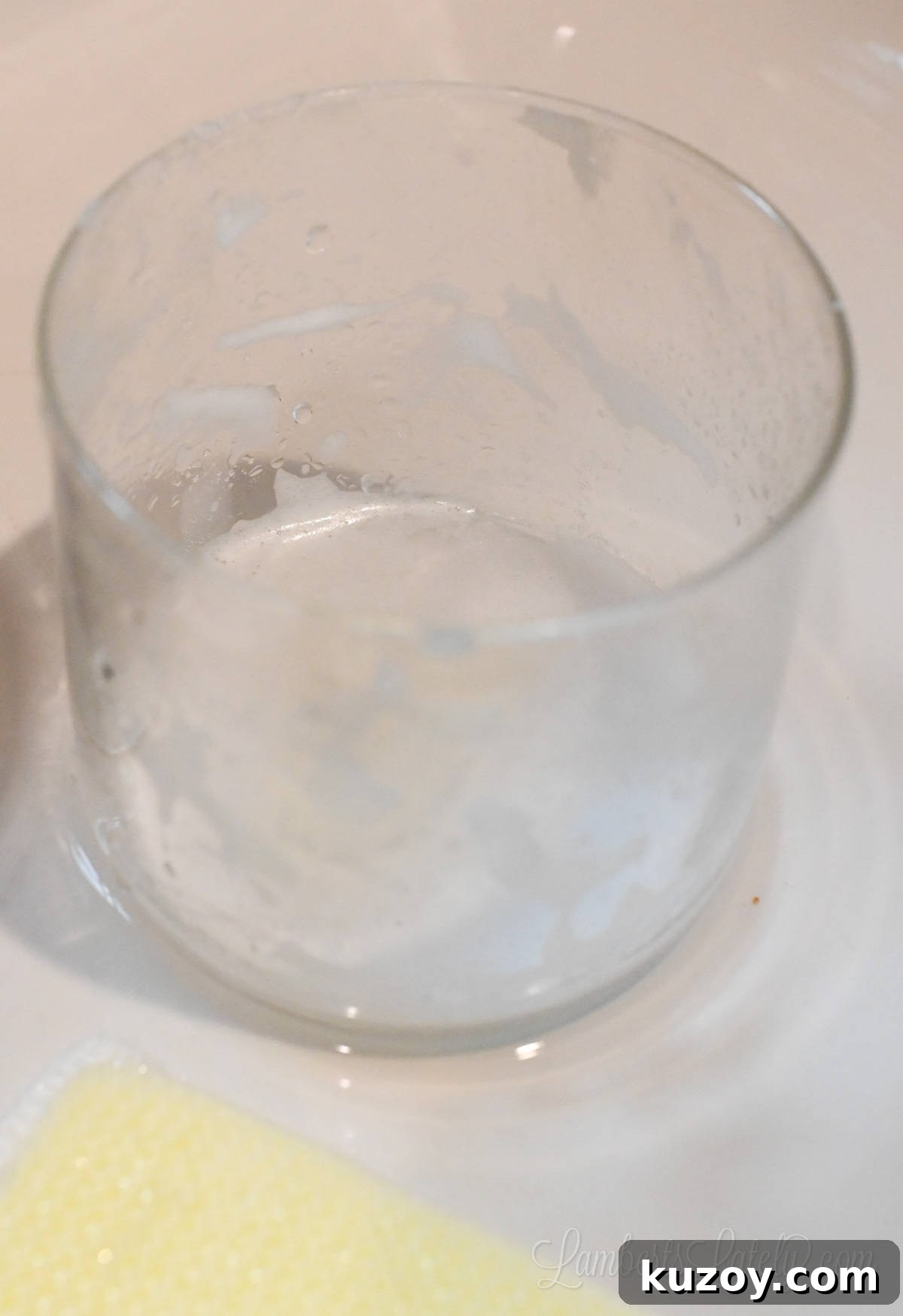 Remove Wax from Candle Jars: 3 Fast, Effective Methods 15 glass jar covered with soap in a sink.