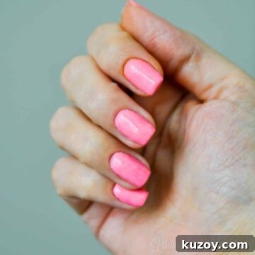 hand with revel nail hottie dip powder.