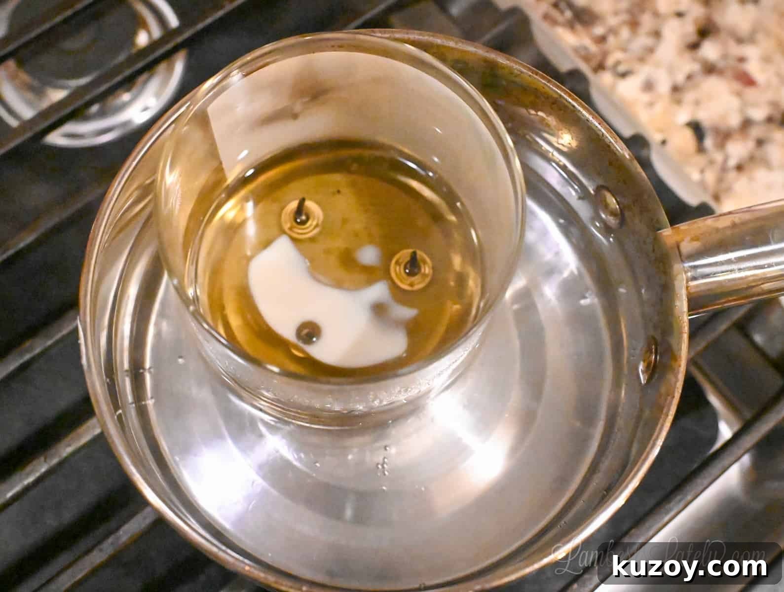 Remove Wax from Candle Jars: 3 Fast, Effective Methods 8 candle melting in water in a saucepan.