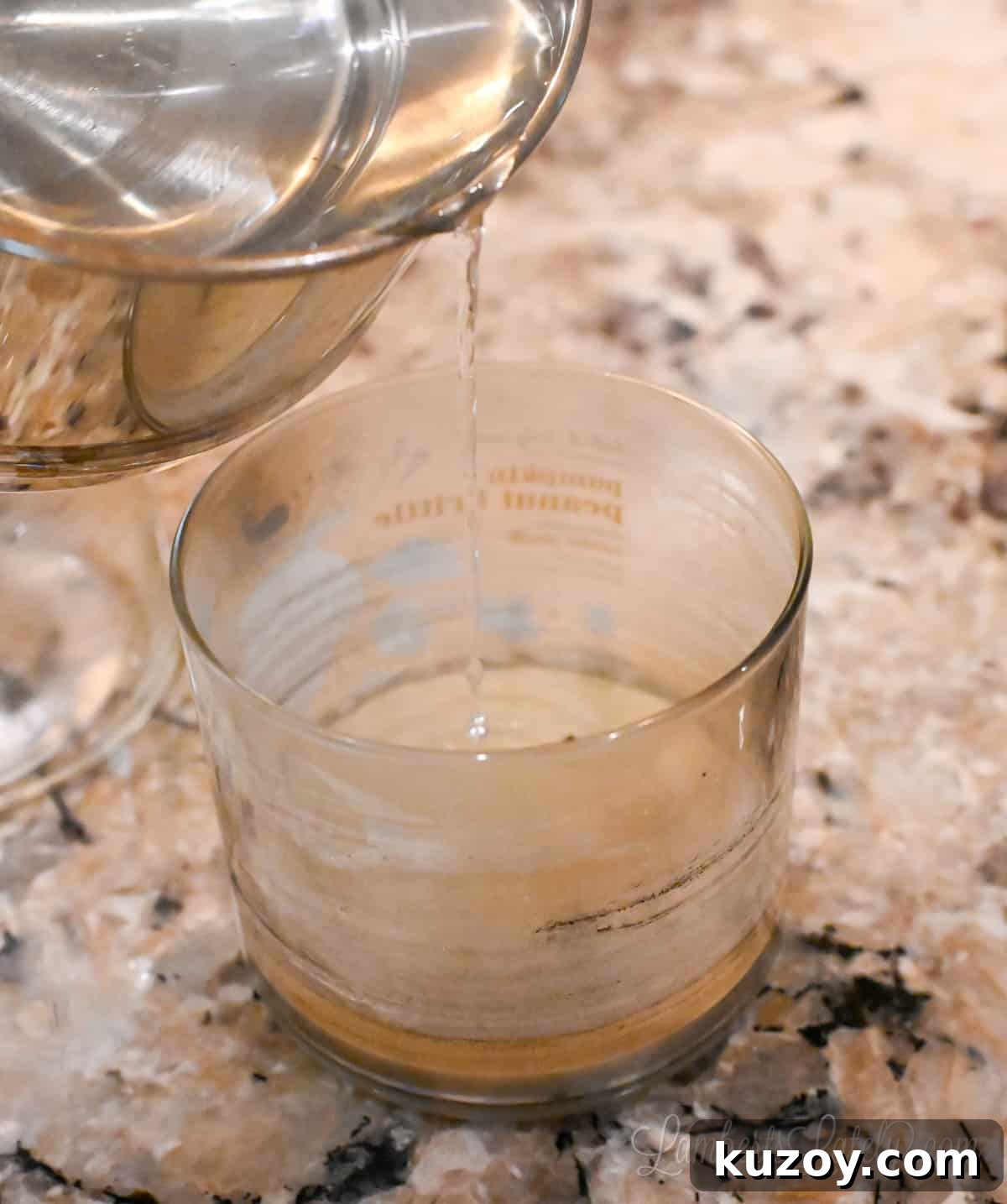 Remove Wax from Candle Jars: 3 Fast, Effective Methods 9 pouring hot water into a used candle jar.