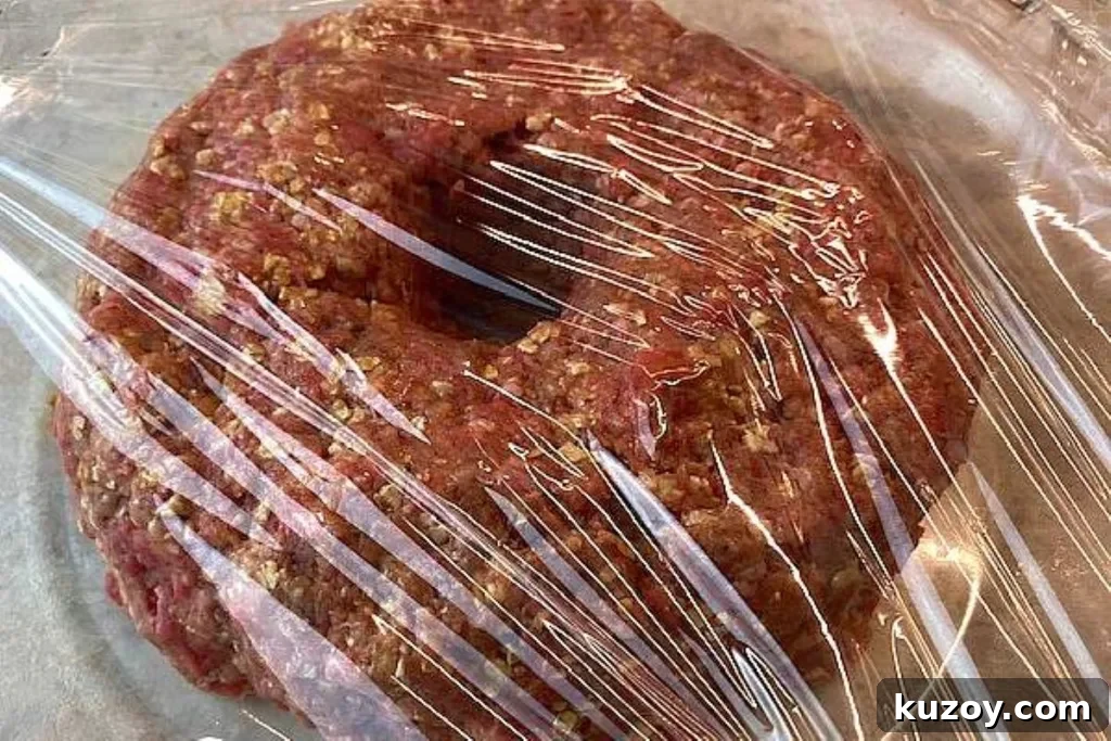 Mouthwatering Meatloaf Recipe That Tastes Like Comfort Food 5 cover meatloaf with plastic film