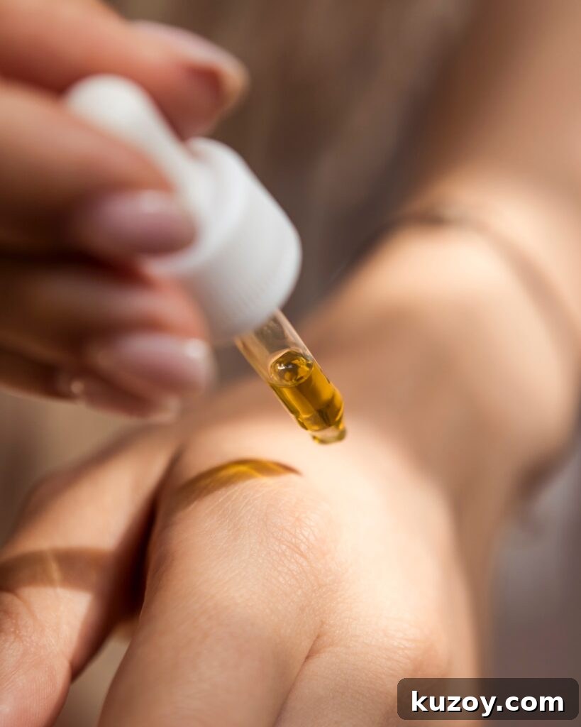 Applying oil to hand.