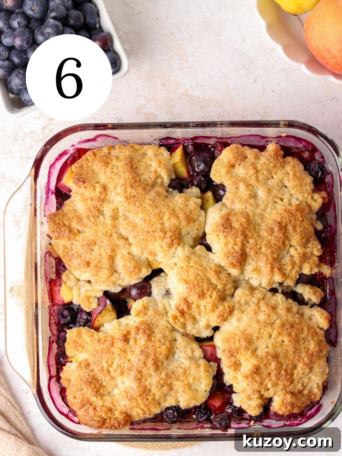 Peach Blueberry Cobbler Recipe: Sweet Summer Fruit Cobbler 9 Blueberry and peach cobbler in a glass baking pan.