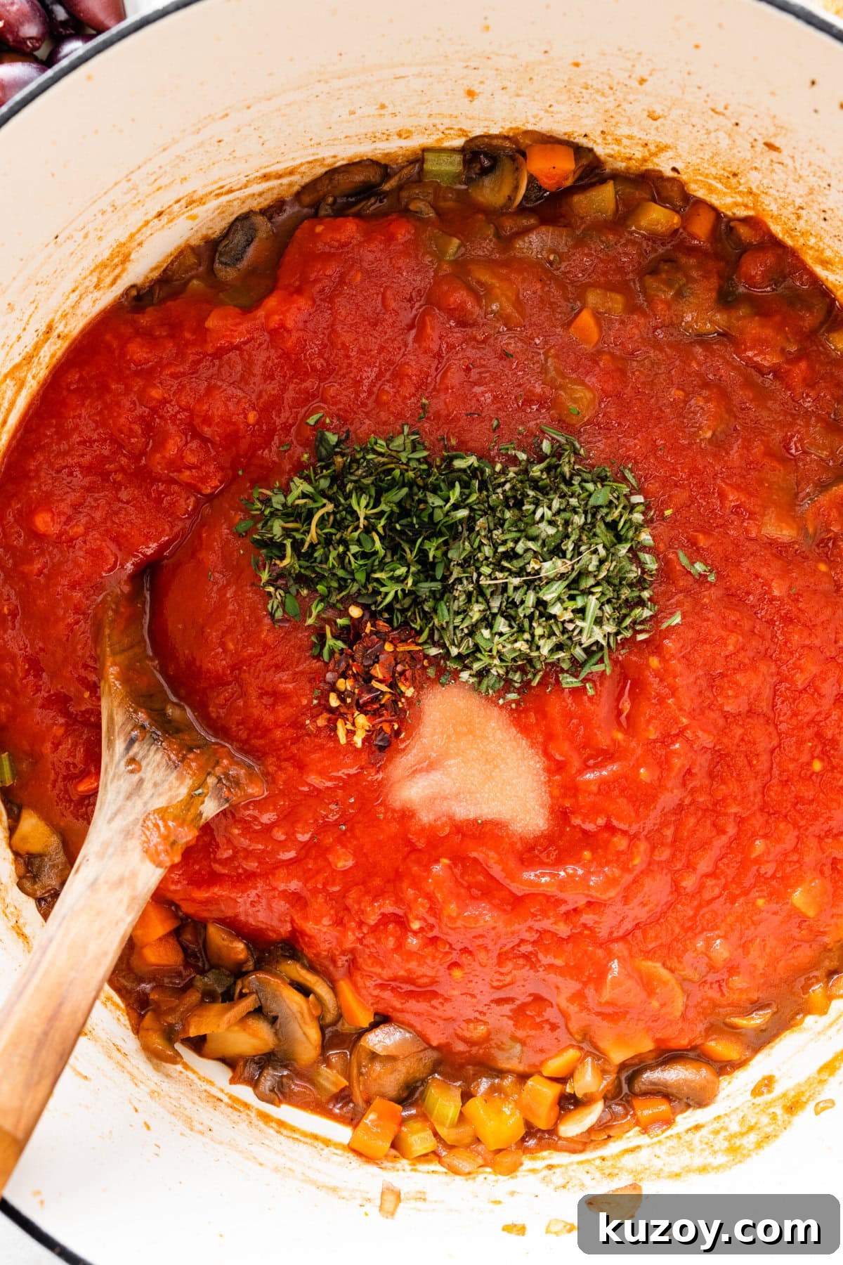 Authentic Chicken Cacciatore Recipe: Classic Italian Stew 12 how to make chicken cacciatore recipe step-by-step: add the tomato sauce and herbs.