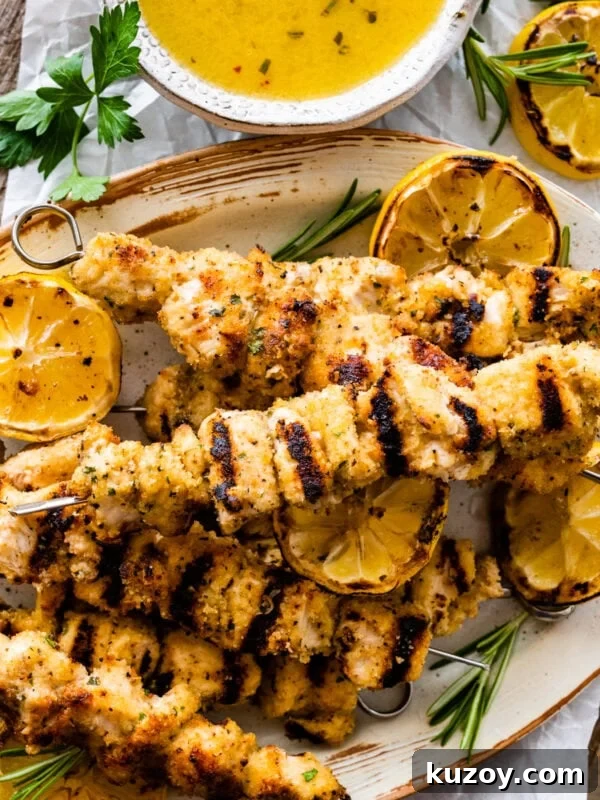 Authentic Chicken Cacciatore Recipe: Classic Italian Stew 17 chicken spiedini recipe on a platter with grilled lemons and herbs.