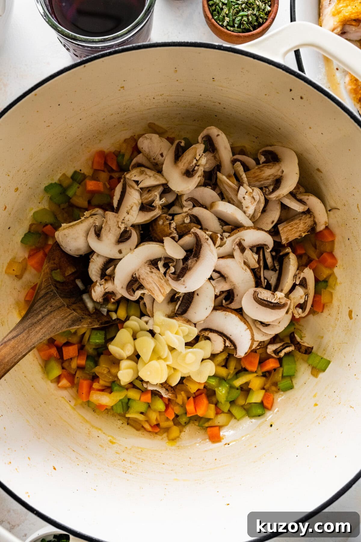 Authentic Chicken Cacciatore Recipe: Classic Italian Stew 10 how to make chicken cacciatore recipe step-by-step: add the mushrooms and garlic to the pot.