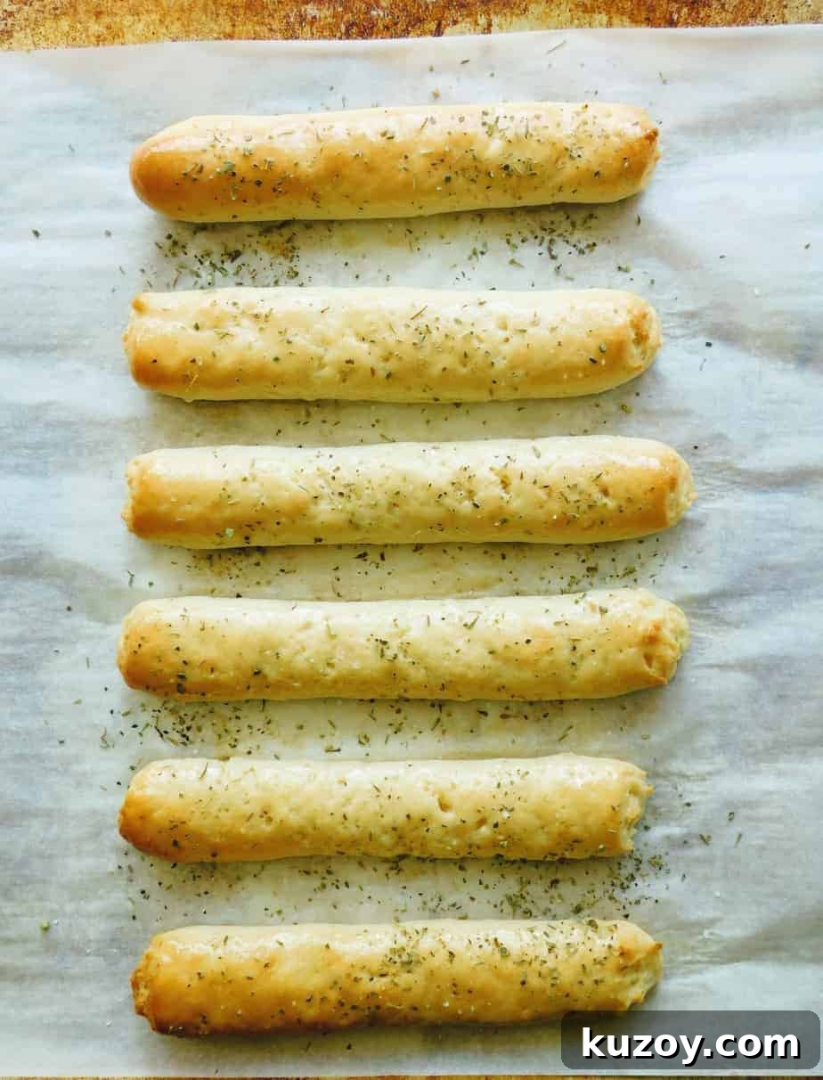 Gluten-Free Breadsticks Recipe That Will Impress Everyone 14 gluten-free breadsticks baked and seasoned
