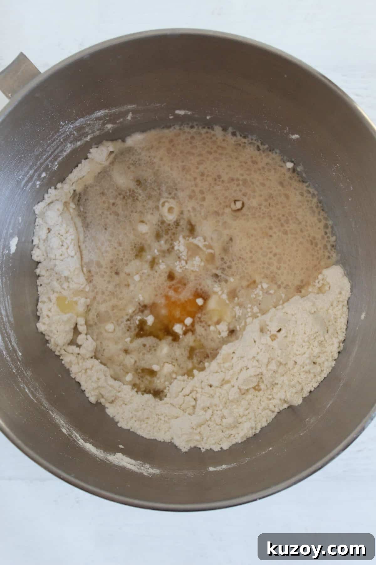 Gluten-Free Breadsticks Recipe That Will Impress Everyone 8 adding wet ingredients to the bowl