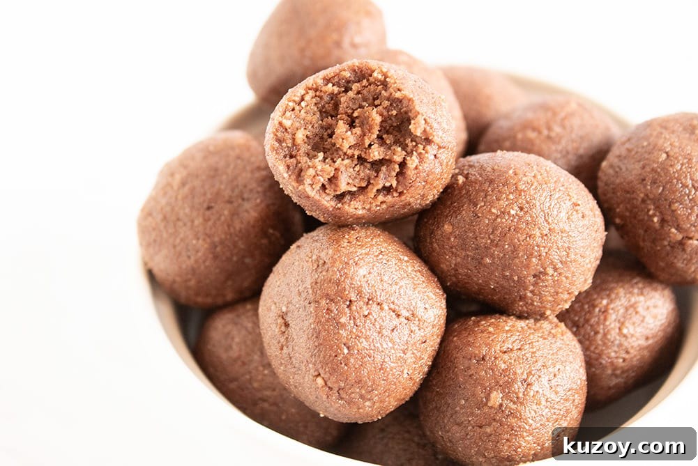 Caffeinated Keto Chocolate Coffee Fat Bombs for Energy 9 closeup of keto chocolate fat bombs in white bowl with white background