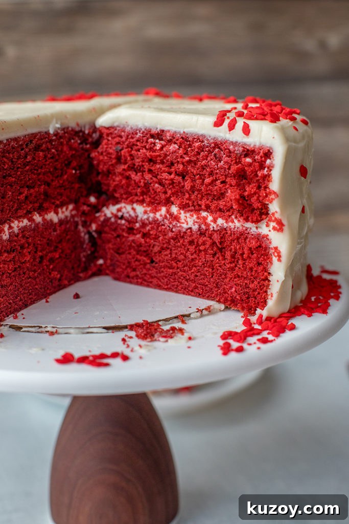 One-Bowl Red Velvet Layer Cake Recipe for Moist Layers 2 A cut open cross-section of red velvet layer cake.