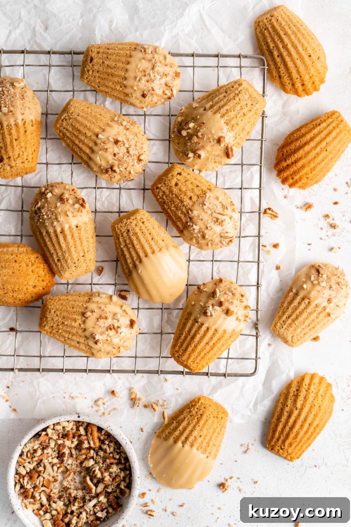 Maple Chai Madeleines Recipe: Spiced Tea-Infused French Cookies 5 maple chai spiced madeleines dipped in a maple glaze and sprinkled with crushed pecans