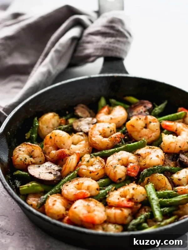 Spicy Cajun Shrimp Skewers with Garlic Butter Dip 10 Sauteed shrimp, asparagus and mushrooms in a skillet.