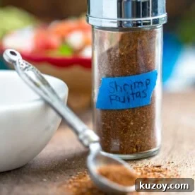 Shrimp Fajitas Seasoning Blend bottle and spoon