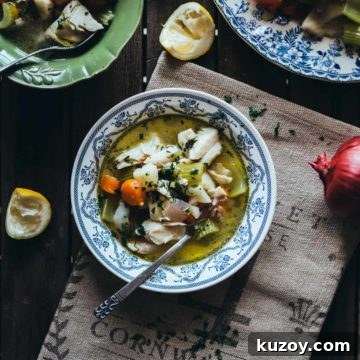 Greek Psarosoupa: Traditional Fish Soup Recipe with Lemon & Herbs 4 fish and vegetable soup served in a bowl