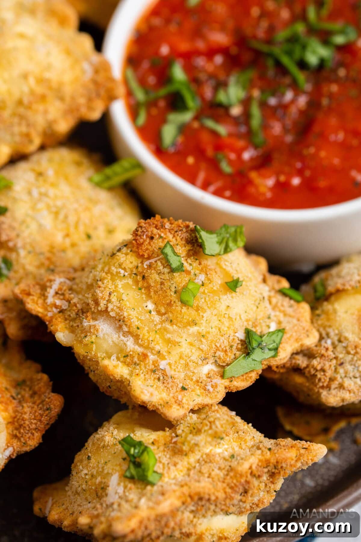 Crispy Air Fryer Ravioli with Marinara Dipping Sauce 3 air fryer ravioli with dish of marinara