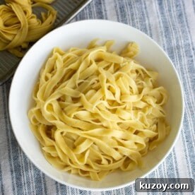 Sourdough pasta in a bowl on a tablecloth.