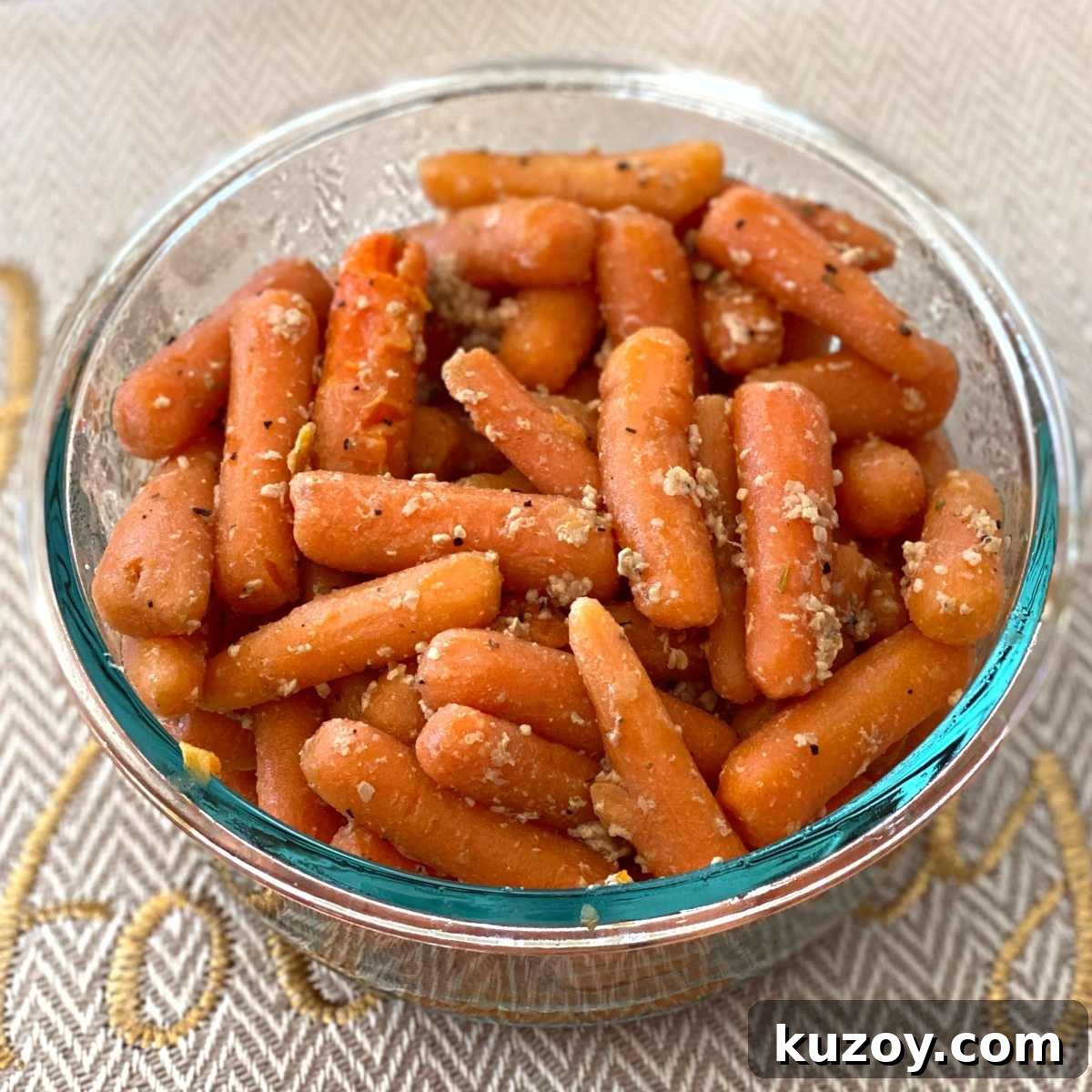 Garlic sauteed baby carrots in a serving dish.