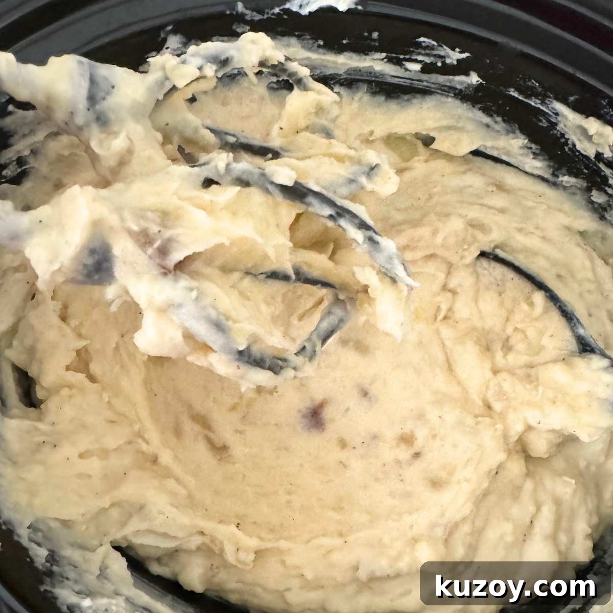 Cream Cheese Crock-Pot Mashed Potatoes — Slow Cooker Recipe 6 Electric beaters inside the crockpot with creamy mashed potatoes.