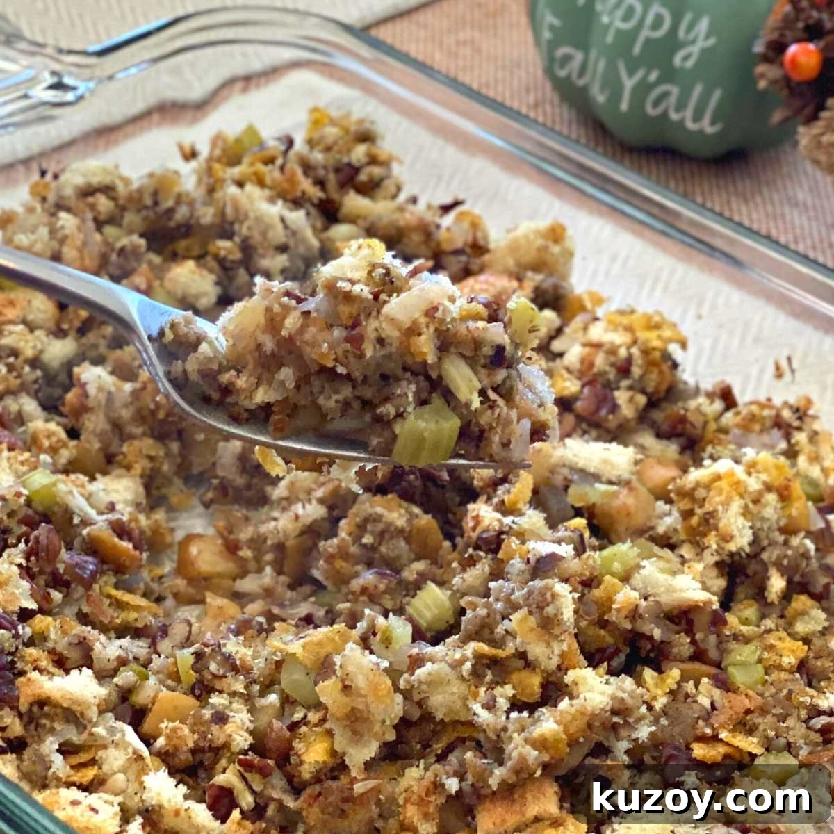 Make-ahead Oven Baked Stuffing made with fresh bread, apples, and pecans, in a casserole dish.