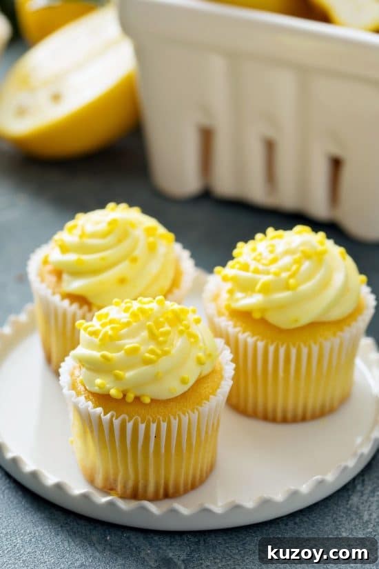 Gluten-free lemon cupcakes made with yellow food coloring in the cupcakes and frosting,