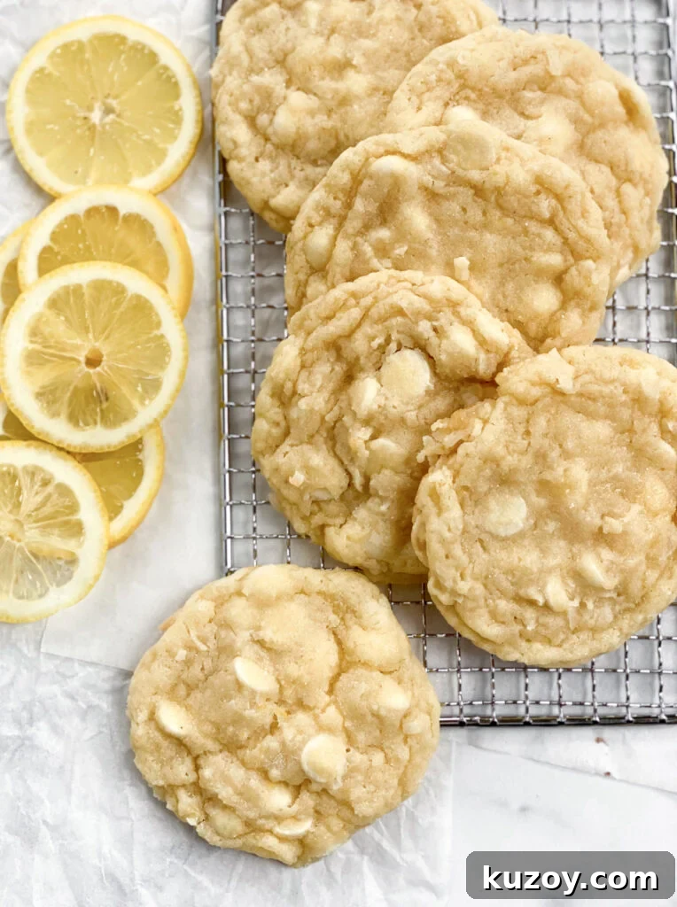 Lemon Coconut White Chocolate Cookie Recipe for Zesty Treats 2 Lemon coconut white chocolate cookies layered with lemons near by