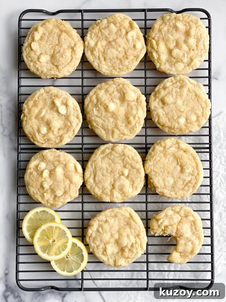 Lemon Coconut White Chocolate Cookie Recipe for Zesty Treats 9 cookies on cooling rack, one bite missing