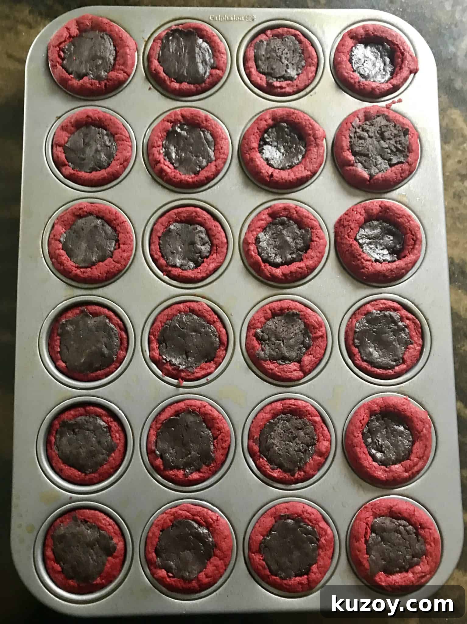 Red Velvet Oreo Valentine Dessert Cups: Romantic No-Bake Treats 6 red velvet cake mix balls in mini muffin pan filled with Oreo truffle mix overhead shot
