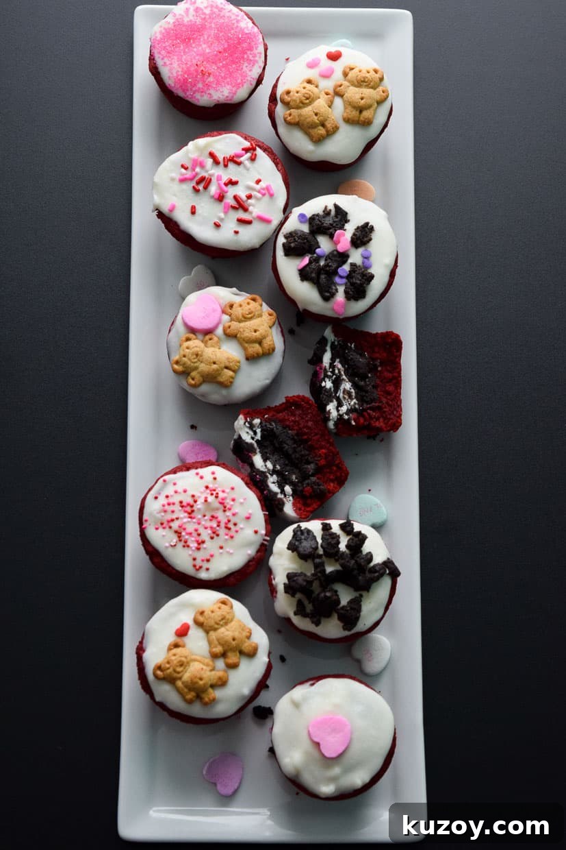 Red Velvet Oreo Valentine Dessert Cups: Romantic No-Bake Treats 8 Red Velvet Oreo Valentine Cups on white platter with conversation hearts overhead shot