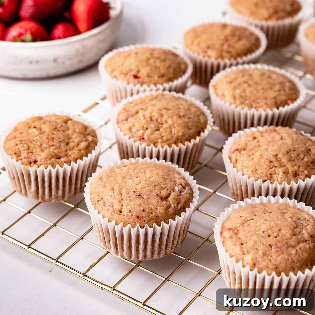 9 Strawberry Cupcakes on a wire cooling rack
