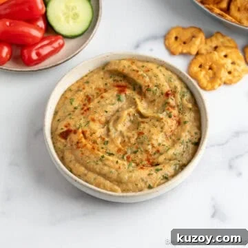 Roasted Eggplant Dip topped with paprika.