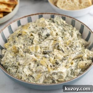 Creamy Spinach and Artichoke Dip Recipe for Entertaining 13 Spinach Artichoke Dip in a bowl.