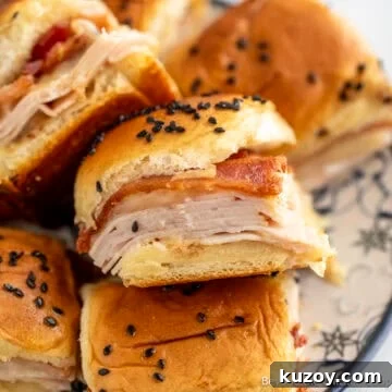 A pile of Turkey Bacon Sliders on a plate.