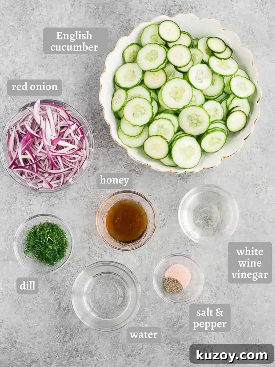 Refreshing Cucumber Salad with Dill and Lemon Vinaigrette 4 cucumbers red onion and dressing ingredients on a board