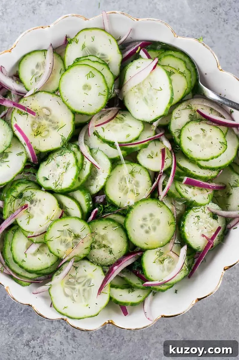 Refreshing Cucumber Salad with Dill and Lemon Vinaigrette 7 healthy cucumber salad and red onion in a bowl
